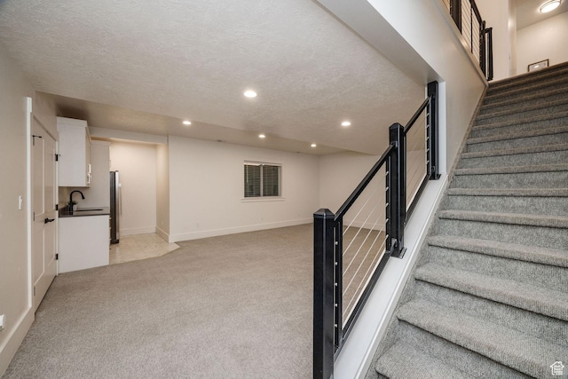 104 S 950 E, Hyde Park, UT 84318 - stairs featuring carpet, recessed lighting, a textured ceiling, and baseboards