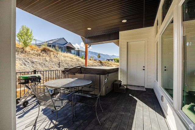 104 S 950 E, Hyde Park, UT 84318 - wooden terrace featuring a hot tub, outdoor dining area, and a mountain view
