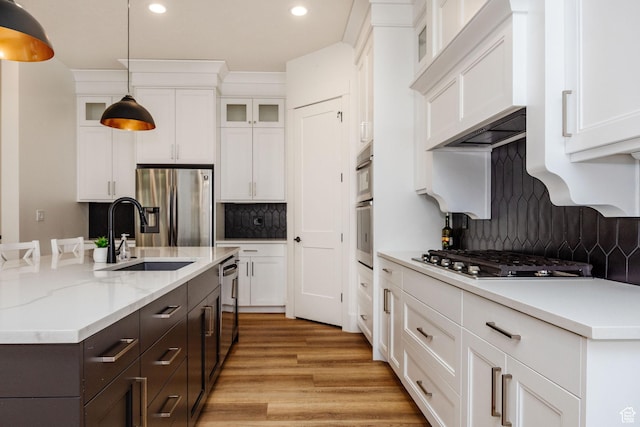 104 S 950 E, Hyde Park, UT 84318 - kitchen featuring a sink, stainless steel appliances, white cabinetry, recessed lighting, and decorative backsplash