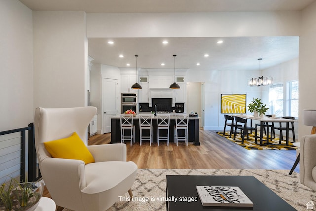 104 S 950 E, Hyde Park, UT 84318 - living room featuring light wood-type flooring, recessed lighting, a chandelier, and baseboards