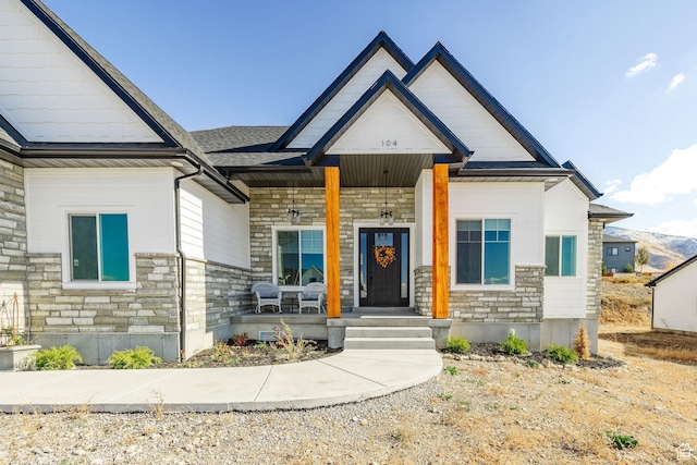 104 S 950 E, Hyde Park, UT 84318 - view of front of house featuring stone siding and a porch