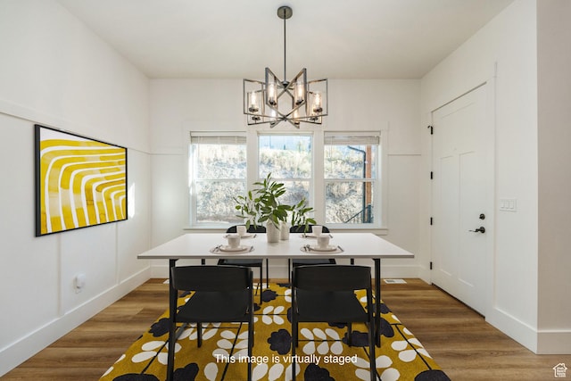104 S 950 E, Hyde Park, UT 84318 - dining room with a chandelier, wood finished floors, and baseboards