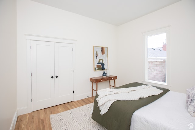 717 E Logan Ave, Salt Lake City, UT 84105 - bedroom featuring light hardwood / wood-style floors and a closet