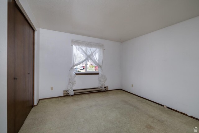 1390 N 500 W, Vernal, UT 84078 - unfurnished bedroom with baseboard heating, carpet flooring, a closet, and baseboards
