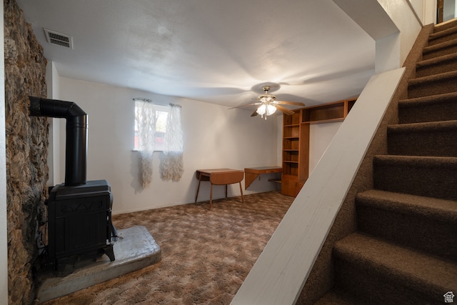 1390 N 500 W, Vernal, UT 84078 - living room featuring a wood stove, carpet floors, and ceiling fan
