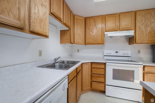 1390 N 500 W, Vernal, UT 84078 - kitchen featuring white appliances, under cabinet range hood, a sink, and light countertops