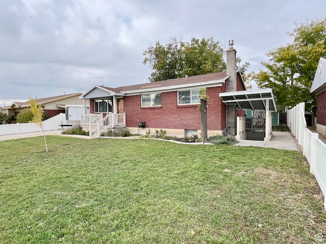 1066 W 450 N, Provo, UT 84601 - single story home featuring a front yard, brick siding, a fenced backyard, and a chimney