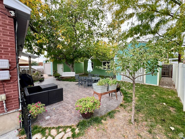 1066 W 450 N, Provo, UT 84601 - view of yard featuring an outdoor hangout area, a fenced backyard, an outdoor structure, a patio area, and outdoor dining area