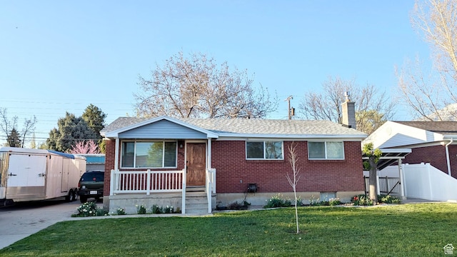 1066 W 450 N, Provo, UT 84601 - single story home with a chimney, a front lawn, brick siding, fence, and covered porch