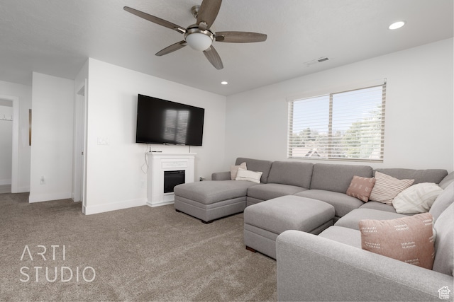 living room with light carpet and ceiling fan