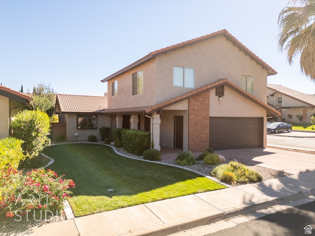 view of front facade with a front lawn and a garage