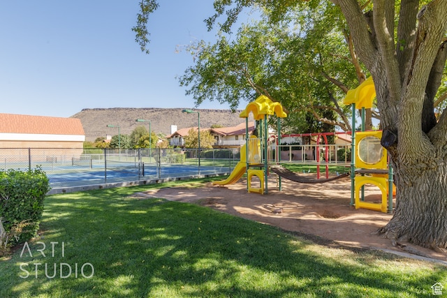 view of playground featuring a lawn