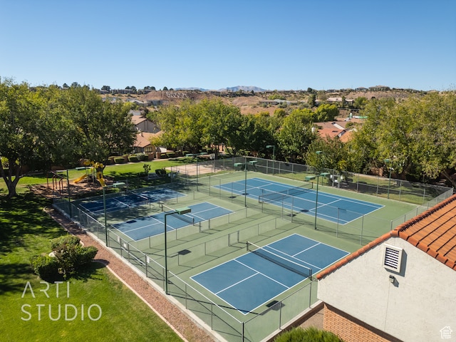 view of sport court featuring a playground