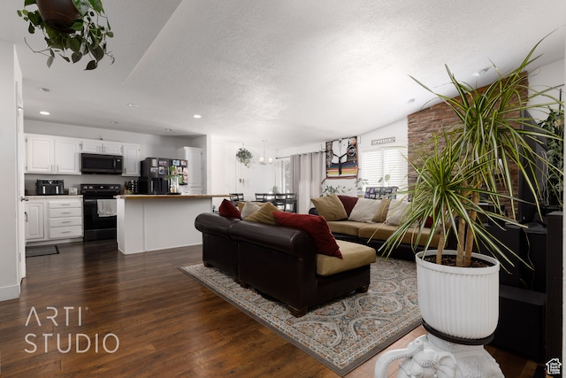 living room featuring a notable chandelier, lofted ceiling, a textured ceiling, and dark hardwood / wood-style flooring