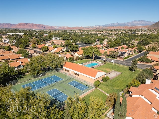birds eye view of property with a mountain view