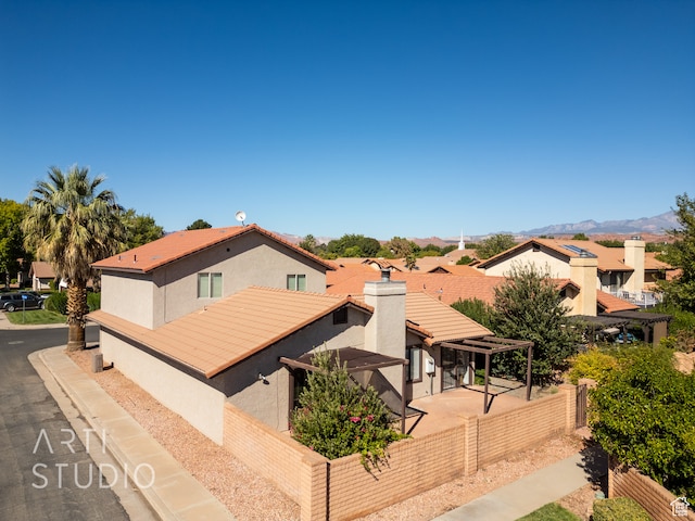 mediterranean / spanish house featuring a mountain view