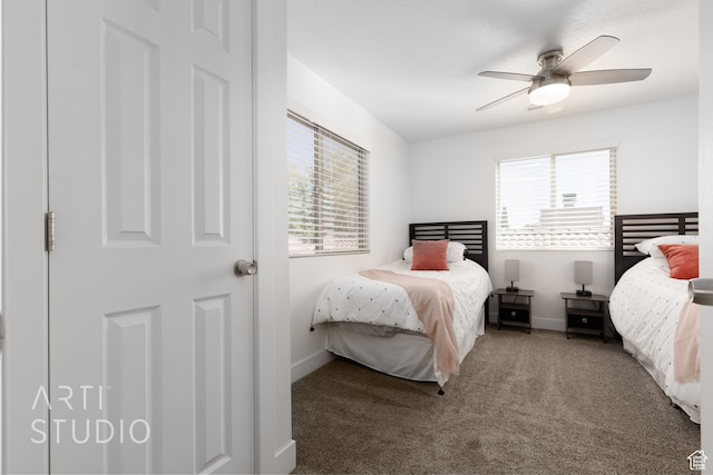 bedroom featuring multiple windows, carpet flooring, and ceiling fan
