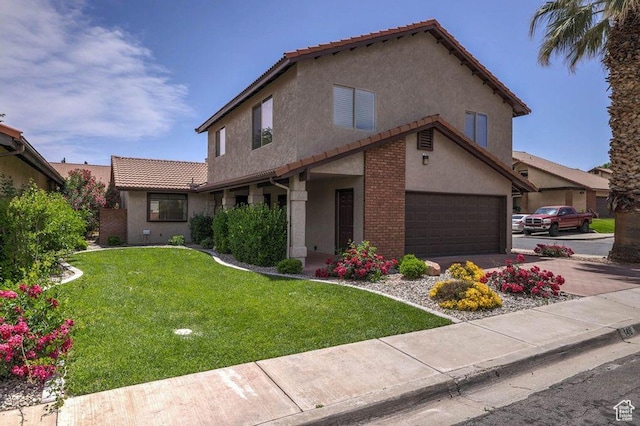 view of front of property with a front lawn and a garage