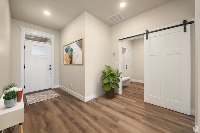 447 S 580 W, Providence, UT 84332 - entrance foyer featuring a barn door, baseboards, dark wood-style floors, and recessed lighting