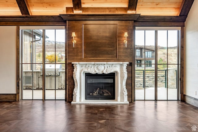 1254 N Explorer Peak Cir, Heber City, UT 84032 - unfurnished living room featuring beam ceiling, baseboards, and a high end fireplace