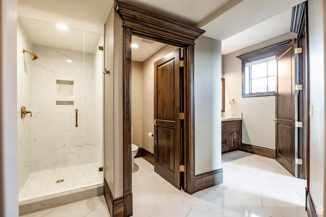 1254 N Explorer Peak Cir, Heber City, UT 84032 - full bathroom featuring toilet, marble finish floor, a marble finish shower, baseboards, and vanity