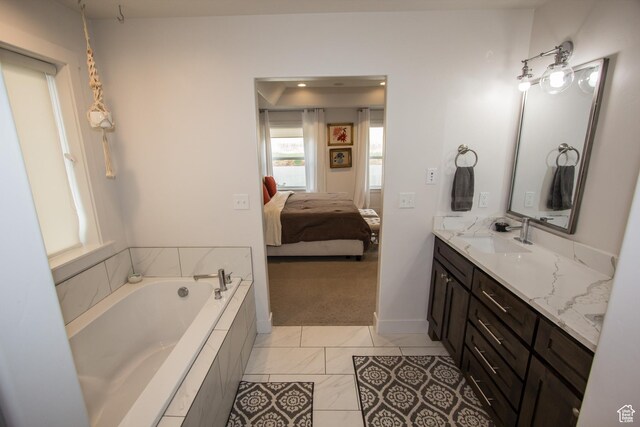 520 N 900 E, Hyde Park, UT 84318 - full bathroom featuring ensuite bathroom, a garden tub, vanity, and baseboards
