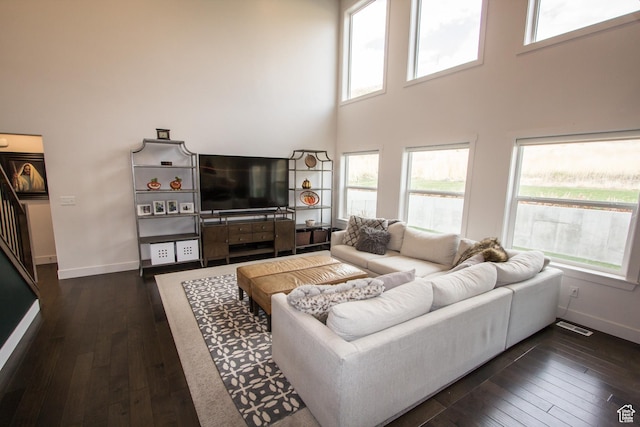 520 N 900 E, Hyde Park, UT 84318 - living room with baseboards, dark wood-style flooring, and a towering ceiling