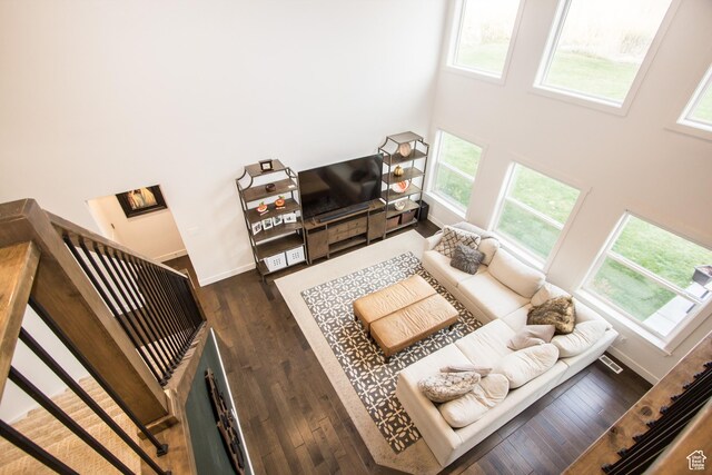 520 N 900 E, Hyde Park, UT 84318 - living area featuring healthy amount of natural light, a towering ceiling, wood finished floors, and baseboards