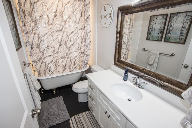 520 N 900 E, Hyde Park, UT 84318 - full bathroom featuring a freestanding tub, vanity, tile patterned flooring, and toilet