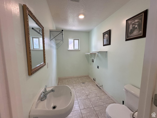 642 W 1150th St S, Provo, UT 84601 - bathroom with a textured ceiling, a sink, toilet, tile patterned floors, and baseboards