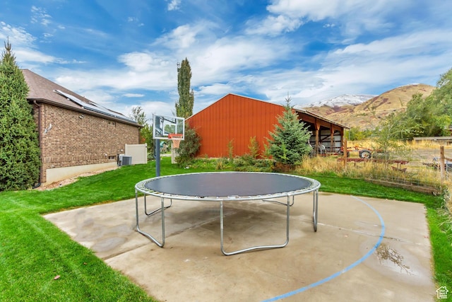 995 W 2650 S, Perry, UT 84302 - view of patio / terrace with a trampoline and a mountain view