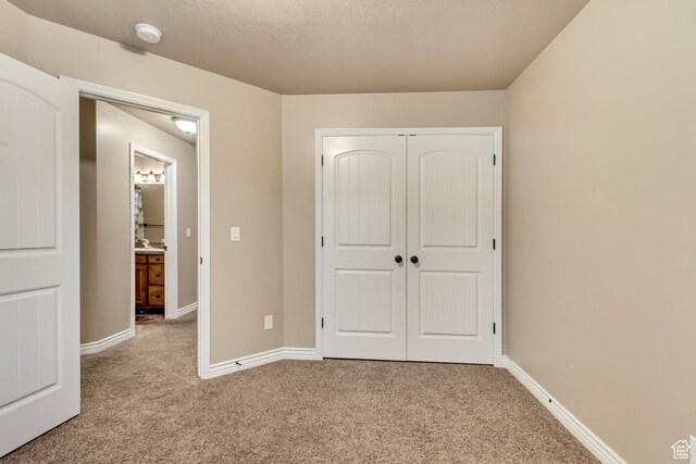 995 W 2650 S, Perry, UT 84302 - unfurnished bedroom featuring carpet floors, baseboards, and a closet