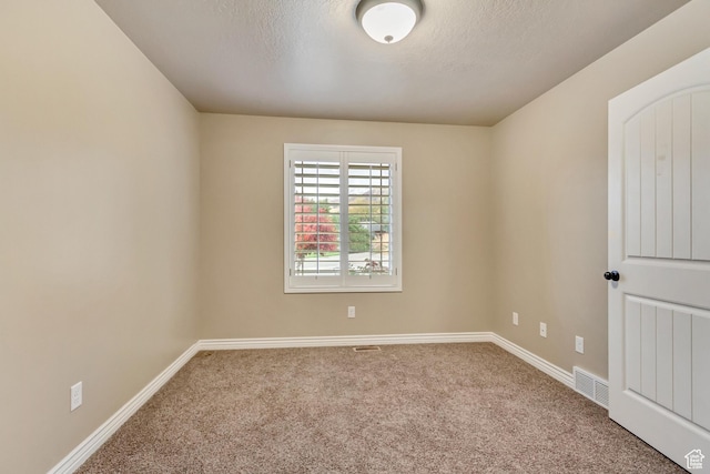 995 W 2650 S, Perry, UT 84302 - unfurnished room with carpet flooring, baseboards, and a textured ceiling