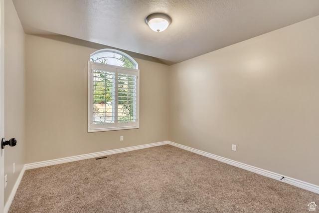 995 W 2650 S, Perry, UT 84302 - spare room with carpet flooring, baseboards, and a textured ceiling