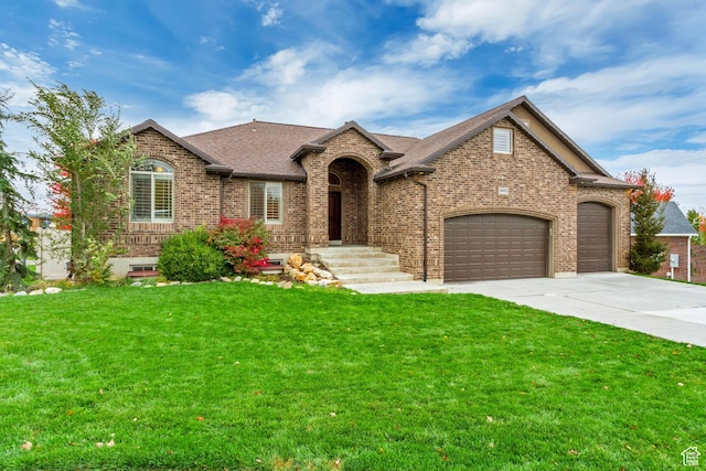 995 W 2650 S, Perry, UT 84302 - view of front facade featuring brick siding, an attached garage, driveway, a front yard, and roof with shingles
