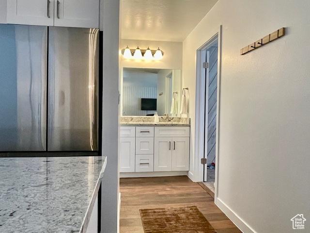385 S Vasels Rd Unit 21, Brian Head, UT 84719 - bathroom with vanity, wood finished floors, and baseboards