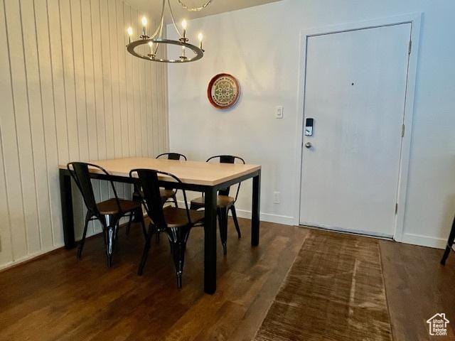 385 S Vasels Rd Unit 21, Brian Head, UT 84719 - dining room featuring a chandelier, dark wood-type flooring, wood walls, and baseboards
