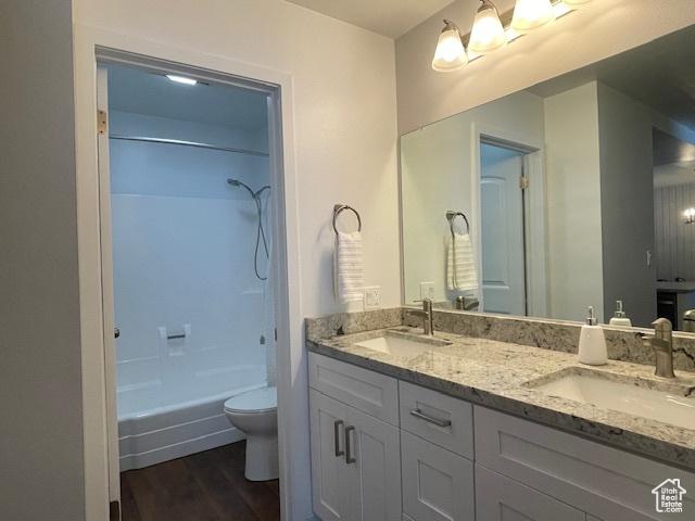 385 S Vasels Rd Unit 21, Brian Head, UT 84719 - full bathroom with toilet, double vanity, wood finished floors, and tub / shower combination