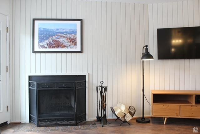 385 S Vasels Rd Unit 21, Brian Head, UT 84719 - living room featuring a fireplace, wood finished floors, and wooden walls
