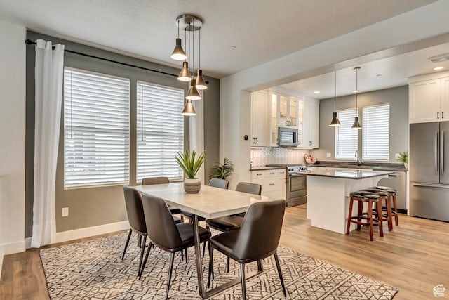 11211 S Clear Blue Dr, South Jordan, UT 84009 - dining area with light wood-style floors, baseboards, and recessed lighting