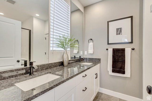 11211 S Clear Blue Dr, South Jordan, UT 84009 - full bathroom with double vanity, baseboards, an enclosed shower, tile patterned floors, and recessed lighting