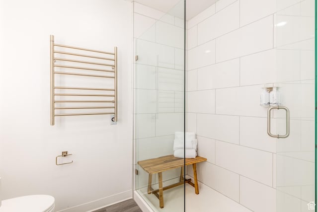 2670 W Canyons Resort Dr Unit 436, Park City, UT 84098 - bathroom with toilet, an enclosed shower, hardwood / wood-style floors, and radiator