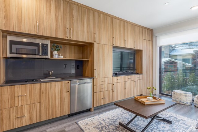 2670 W Canyons Resort Dr Unit 436, Park City, UT 84098 - kitchen with appliances with stainless steel finishes, light brown cabinetry, light wood-style floors, modern cabinets, and a sink