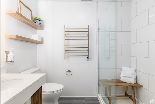 2670 W Canyons Resort Dr Unit 436, Park City, UT 84098 - bathroom featuring a shower with door, toilet, radiator, wood-type flooring, and vanity