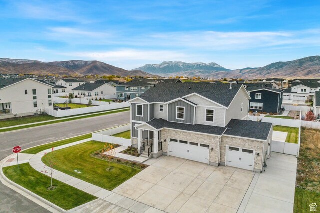 1358 S 1140 E, Heber City, UT 84032 - view of front of property with an attached garage, stone siding, a mountain view, and concrete driveway
