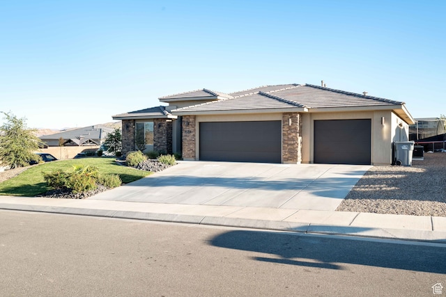 prairie-style house featuring a garage