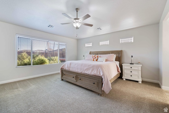 2084 E Sunshine Trl, St George, UT 84790 - bedroom with baseboards, light colored carpet, and a ceiling fan