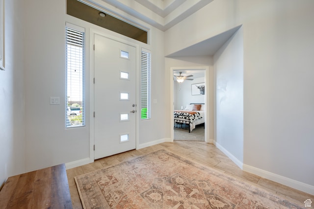 entrance foyer featuring ceiling fan