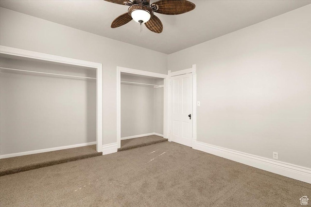114 E Main St, Moroni, UT 84646 - unfurnished bedroom with carpet floors, two closets, and a ceiling fan