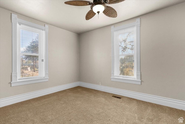 114 E Main St, Moroni, UT 84646 - carpeted spare room with healthy amount of natural light and a ceiling fan